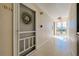 Hallway showing unit 116, an exit sign, and terrazzo floors at 612 Bird Bay S Dr # 116, Venice, FL 34285