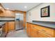 A well-equipped kitchen features stainless steel appliances and maple cabinets at 612 Bird Bay S Dr # 116, Venice, FL 34285