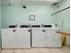 Well-maintained laundry room with several commercial grade washers and dryers at 612 Bird Bay S Dr # 116, Venice, FL 34285