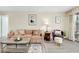 Inviting living room with a comfortable sofa, decorative pillows, and a view to the outside at 612 Bird Bay S Dr # 116, Venice, FL 34285