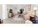 Bright living room featuring a comfortable sofa, a patterned rug, and neutral decor at 612 Bird Bay S Dr # 116, Venice, FL 34285