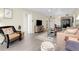 Open living room with neutral walls, ceiling fan, balcony access and tile flooring at 612 Bird Bay S Dr # 116, Venice, FL 34285