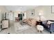 Bright living room featuring a comfortable sofa, a patterned rug, and neutral decor at 612 Bird Bay S Dr # 116, Venice, FL 34285
