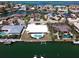 Aerial view of a waterfront home with a pool and private dock on a canal at 618 Gladstone Ln, Holmes Beach, FL 34217