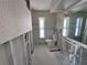 Bathroom studs, floral wallpaper and natural light at 618 Gladstone Ln, Holmes Beach, FL 34217