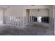 Renovation view of living room showing unfinished walls and exposed flooring at 618 Gladstone Ln, Holmes Beach, FL 34217