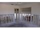 Renovation view of living room showing unfinished walls, exposed flooring, and ceiling fan at 618 Gladstone Ln, Holmes Beach, FL 34217