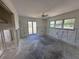 Living room with three windows and a ceiling fan is ready to customize and make your own at 618 Gladstone Ln, Holmes Beach, FL 34217