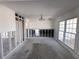Open living space with studs, chandelier, and a bright window view at 618 Gladstone Ln, Holmes Beach, FL 34217