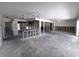 Spacious living room, ready for renovation, with ceiling fans and plenty of natural light at 618 Gladstone Ln, Holmes Beach, FL 34217