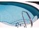 This pool has a metal hand rail to help you get in and out at 618 Gladstone Ln, Holmes Beach, FL 34217