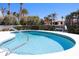 View of the kidney shaped pool featuring turquoise tiles and steel rail at 618 Gladstone Ln, Holmes Beach, FL 34217