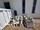 Outdoor pool equipment and filters with a white fence at 618 Gladstone Ln, Holmes Beach, FL 34217