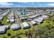 This aerial view showcases the community's layout, with well-maintained homes and a lake at 633 Cervina S Dr, Venice, FL 34285