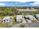 Aerial view of the community, showcasing its layout, lush greenery, and convenient access to nearby amenities at 633 Cervina S Dr, Venice, FL 34285