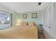 Bedroom features serene ambiance, soft lighting, and coordinated decor with double door closet at 633 Cervina S Dr, Venice, FL 34285