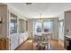 Charming dining room boasts a built-in cabinet, bright natural light, and space for a round dining table at 633 Cervina S Dr, Venice, FL 34285