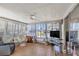 Relaxing Florida room with lots of natural light from the many windows overlooking the community at 633 Cervina S Dr, Venice, FL 34285