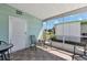 Screened-in lanai with neutral tile flooring and sliding window, offering a perfect spot for outdoor enjoyment at 633 Cervina S Dr, Venice, FL 34285