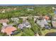 Aerial view of upscale neighborhood with lush landscaping and ponds at 6540 The Masters Ave, Lakewood Ranch, FL 34202