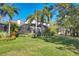 Lush backyard with mature trees and screened lanai at 6540 The Masters Ave, Lakewood Ranch, FL 34202