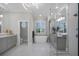 Luxurious bathroom with a freestanding tub, elegant vanities, and a spacious glass-enclosed shower for spa-like experience at 6540 The Masters Ave, Lakewood Ranch, FL 34202