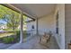 Inviting front porch with rocking chairs, offering a relaxing outdoor space at 6540 The Masters Ave, Lakewood Ranch, FL 34202