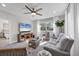 Inviting living room with a comfortable sofa, stylish furnishings, and a large window offering a pleasant view at 6540 The Masters Ave, Lakewood Ranch, FL 34202