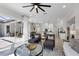 Bright living room with modern decor, plush seating, and seamless indoor-outdoor flow to a luxurious outdoor space at 6540 The Masters Ave, Lakewood Ranch, FL 34202