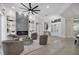 Bright living room boasts a fireplace, built-in shelving, and modern decor at 6540 The Masters Ave, Lakewood Ranch, FL 34202