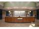 The front desk area is nicely decorated and includes a wood facade and tile backdrop at 6540 The Masters Ave, Lakewood Ranch, FL 34202
