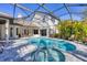 Stunning backyard showcasing a luxurious pool and spa, complemented by manicured greenery at 6540 The Masters Ave, Lakewood Ranch, FL 34202