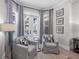 Cozy sitting area with comfortable armchairs, soft natural light, and elegant decor creating a peaceful retreat at 6540 The Masters Ave, Lakewood Ranch, FL 34202