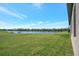 Expansive backyard offering serene water views and ample green space for outdoor enjoyment and relaxation at 6620 35Th E Ct, Sarasota, FL 34243