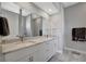 Elegant bathroom featuring a double vanity with marble countertop, undermount sinks, and modern fixtures at 6620 35Th E Ct, Sarasota, FL 34243