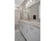 Bathroom with a marble countertop, stylish mirror, and modern fixtures at 6620 35Th E Ct, Sarasota, FL 34243