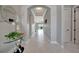 Hallway featuring tile floors and neutral walls leading into the living space at 6620 35Th E Ct, Sarasota, FL 34243
