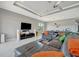Spacious living area with modern decor, recessed lighting, and a partial view of the kitchen at 6620 35Th E Ct, Sarasota, FL 34243