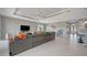 Open-concept living area with modern furniture, television, and recessed lighting at 6620 35Th E Ct, Sarasota, FL 34243
