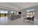 Cozy living room bathed in natural light, with serene outdoor views at 6620 35Th E Ct, Sarasota, FL 34243