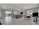 Open concept living area featuring a modern seating arrangement and access to the outdoor patio at 6620 35Th E Ct, Sarasota, FL 34243