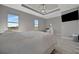 This main bedroom offers plenty of natural light from two windows and a spacious feel at 6620 35Th E Ct, Sarasota, FL 34243