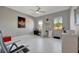 Versatile home office with bright white floors, large windows, and a ceiling fan for added comfort at 6620 35Th E Ct, Sarasota, FL 34243