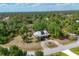 Expansive wooded property featuring a charming home with a circular driveway and lush landscaping at 6838 Rabbit Ave, North Port, FL 34291