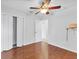 Cozy bedroom featuring wood floors and a closet with bi-fold doors at 6838 Rabbit Ave, North Port, FL 34291