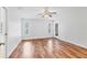 Bright bedroom with wood floors, a ceiling fan, and two windows for natural light at 6838 Rabbit Ave, North Port, FL 34291