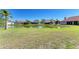 A serene pond view highlights the back yard, providing a peaceful and picturesque setting at 7102 42Nd E Ct, Sarasota, FL 34243