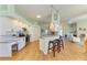 Modern kitchen with granite countertops, stainless steel appliances, and a convenient breakfast bar at 7102 42Nd E Ct, Sarasota, FL 34243