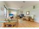 Living area featuring rattan furniture, a fireplace, and views of the outdoor area at 7102 42Nd E Ct, Sarasota, FL 34243