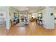 Open floor plan featuring hardwood floors, living room, and sliding glass door to backyard patio at 7102 42Nd E Ct, Sarasota, FL 34243
